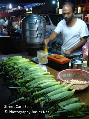 Street photography requires a certain amount of awareness and camera at the ready to grab that shot. In low light condition, some blurness from movement may be expected especially using a compact camera to take a shot like the above.